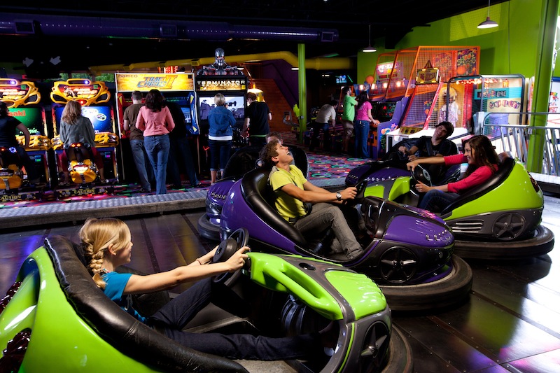 young people ride on the bumper cars